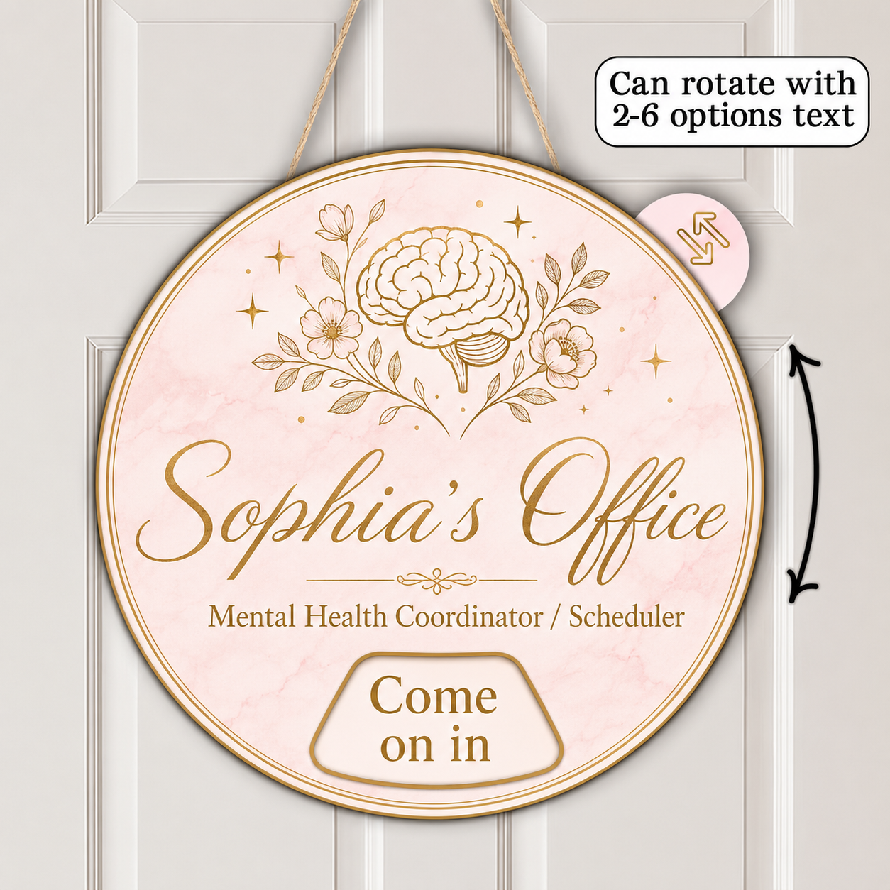 A round hanging personalized sign with a pale pink marble background and gold illustration of a brain, flowers, and stars. The sign reads 'Sophia's Office' and 'Mental Health Coordinator / Scheduler' with 'Come on in' at the bottom.